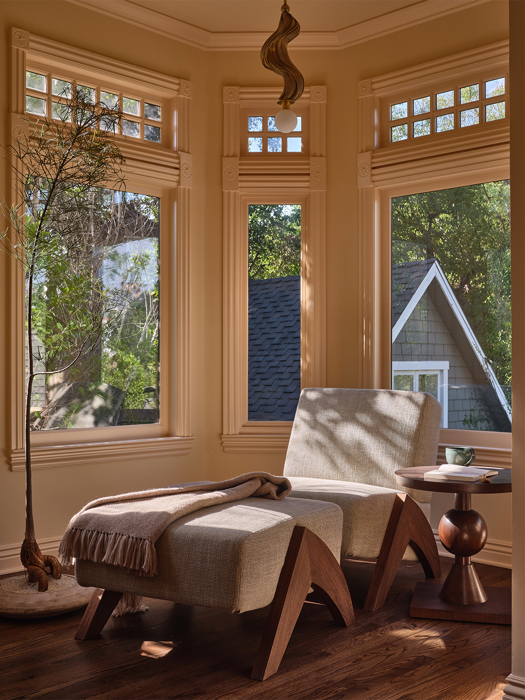 corner of bedroom with chair and ottoman
