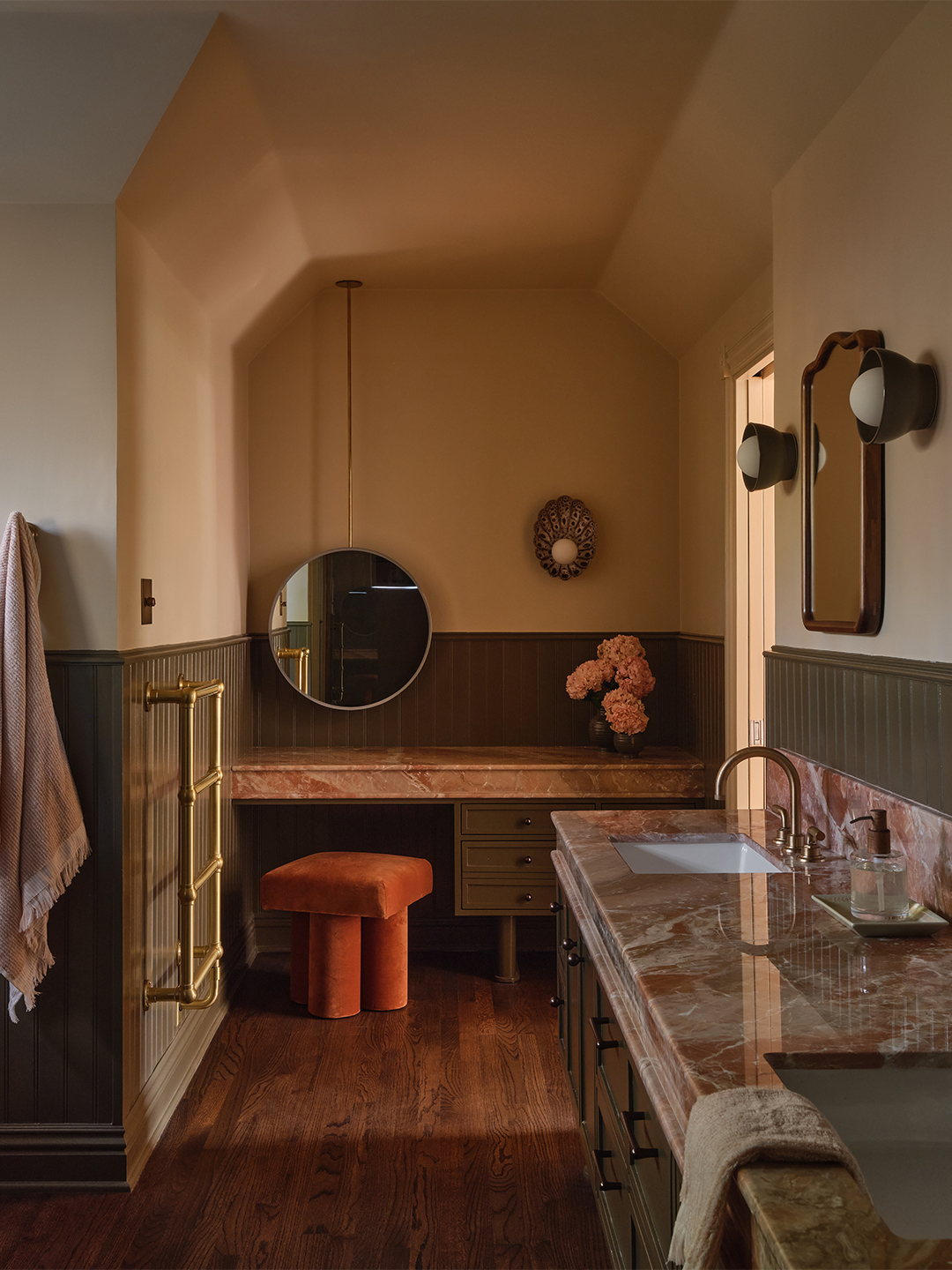 bathroom with pink marble counters and vanity area