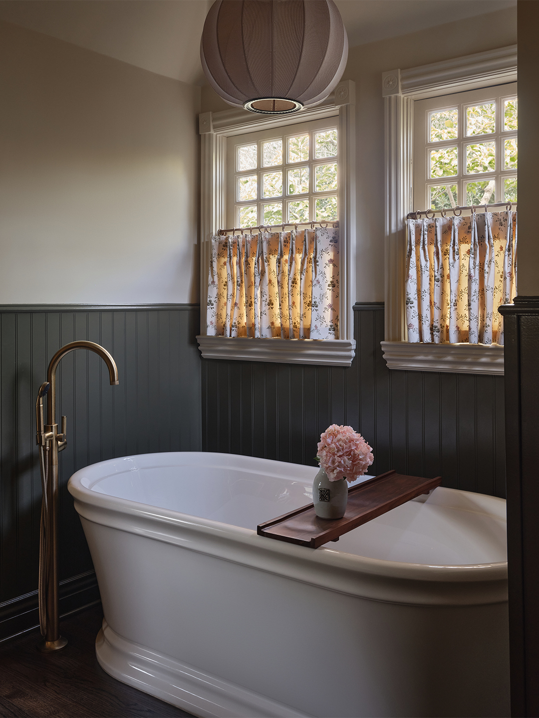 bathroom with large white tub