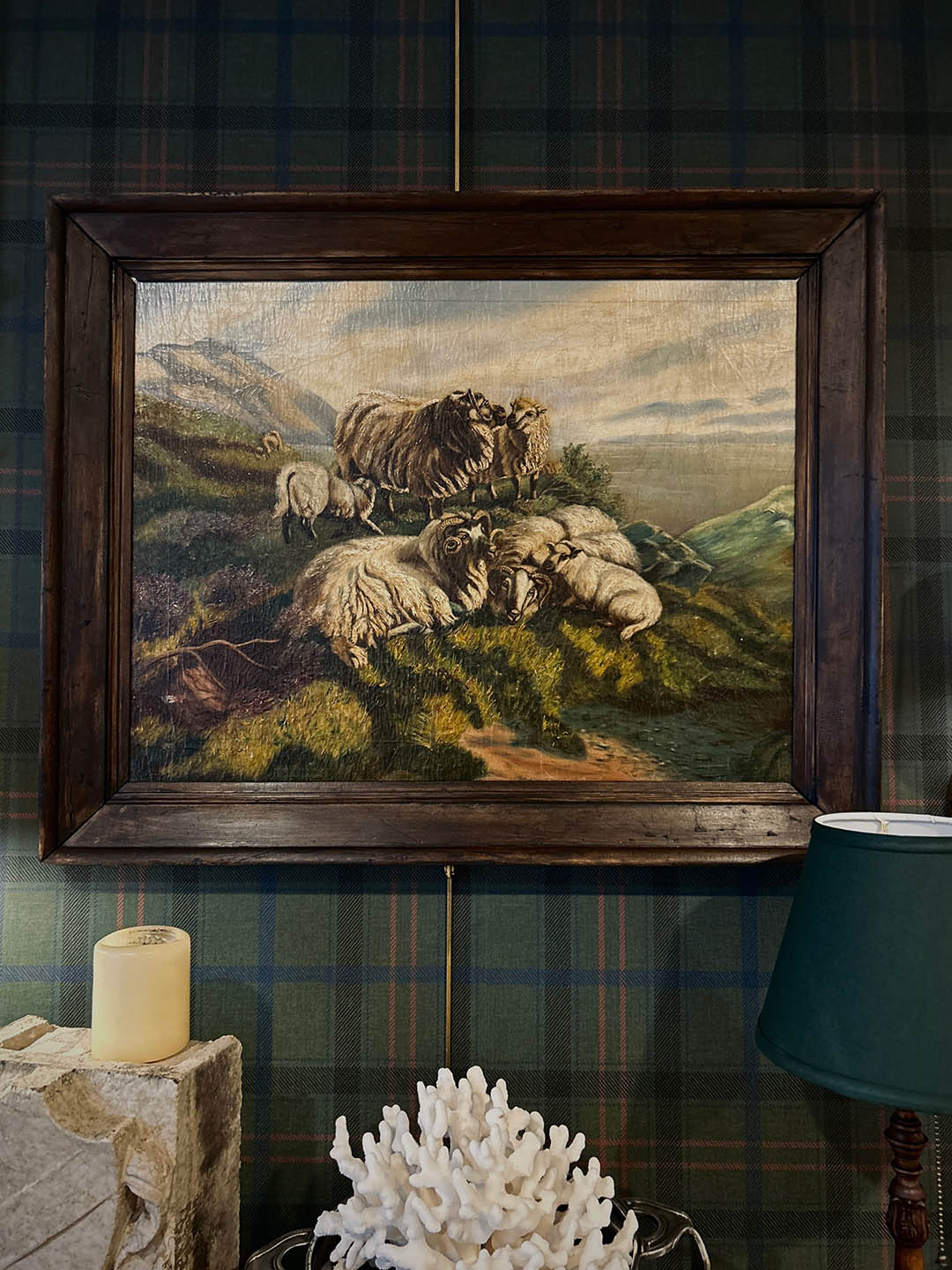 headboard wall with art hanging on it