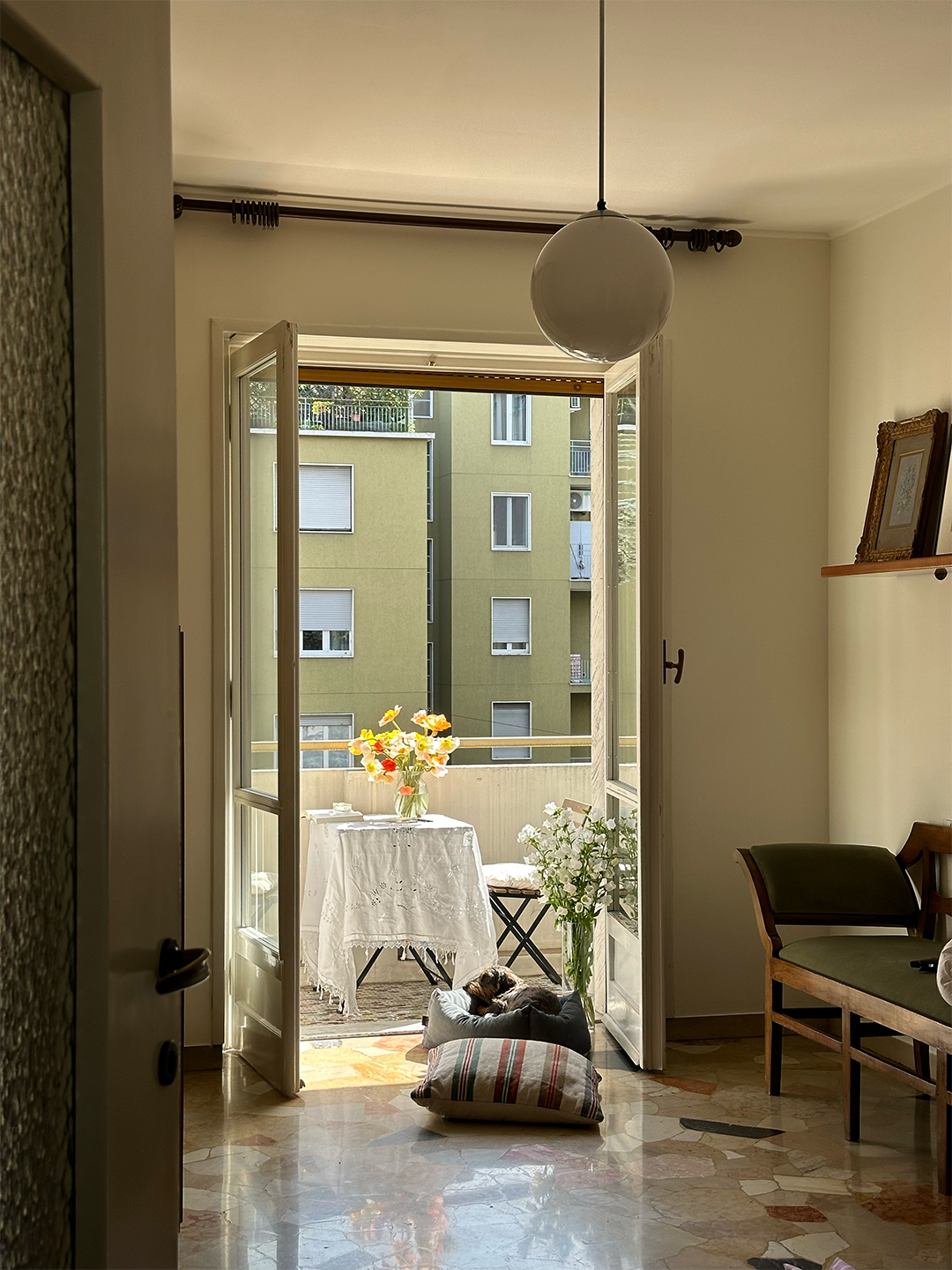 open doors looking onto a city balcony