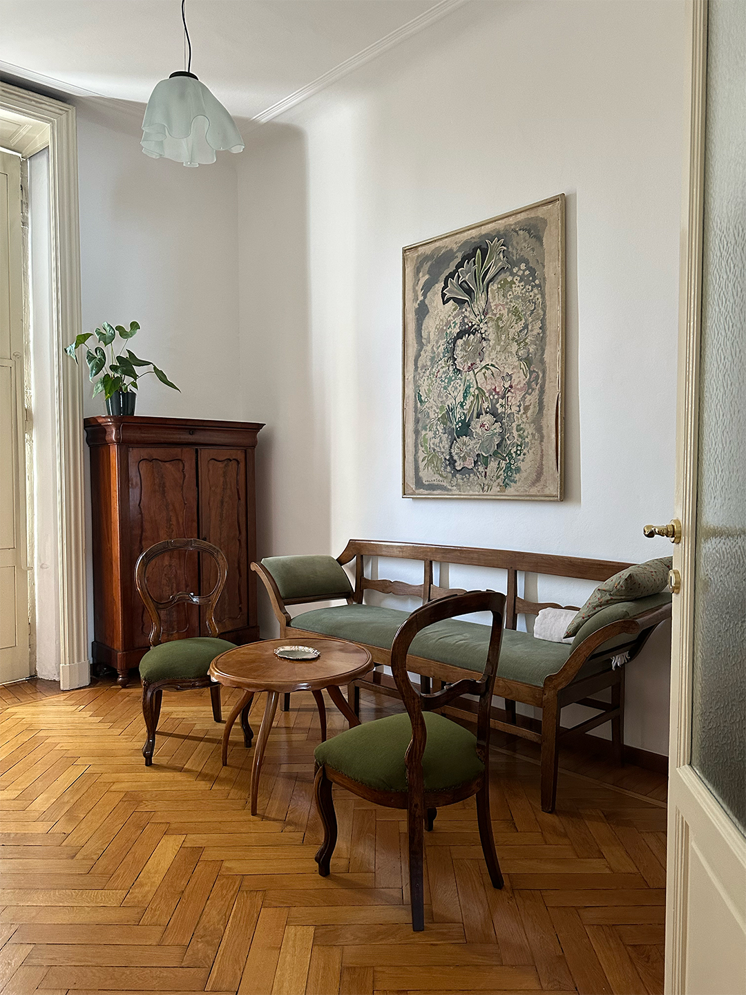 an indoor sitting area with wooden seats and a bench