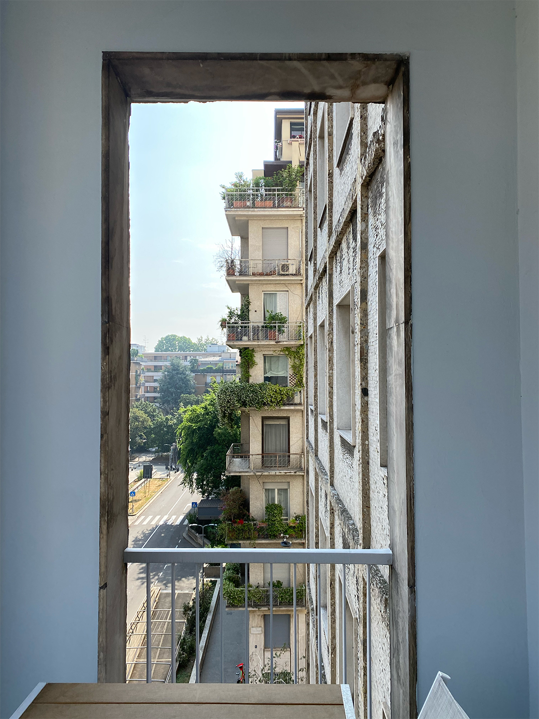 view out of an apartment window onto a city street