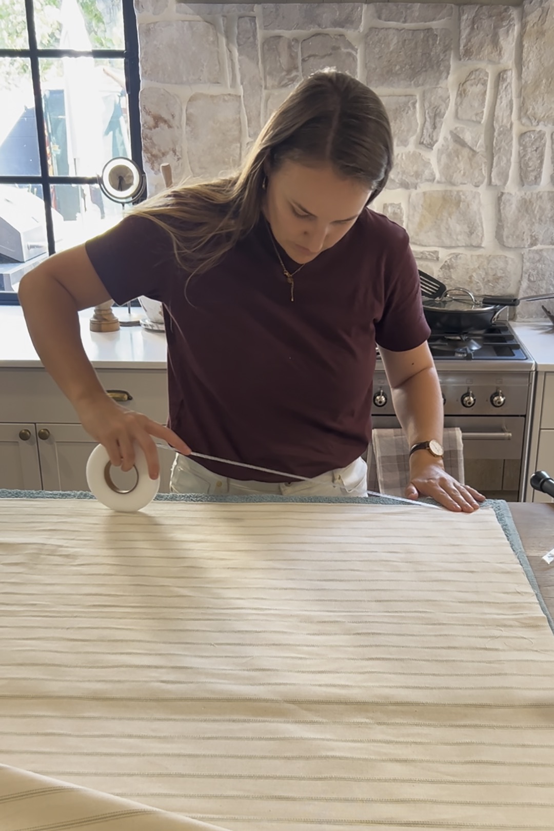woman rolling out hemming tape