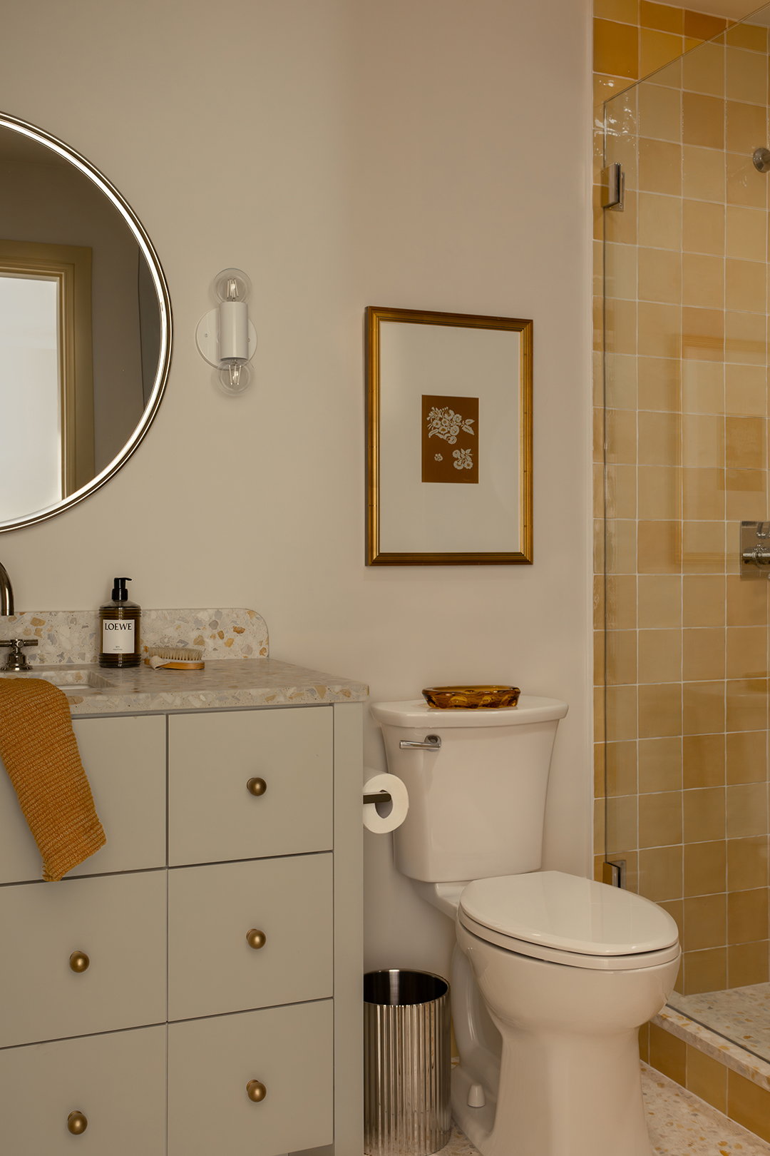 bathroom with yellow tiled shower