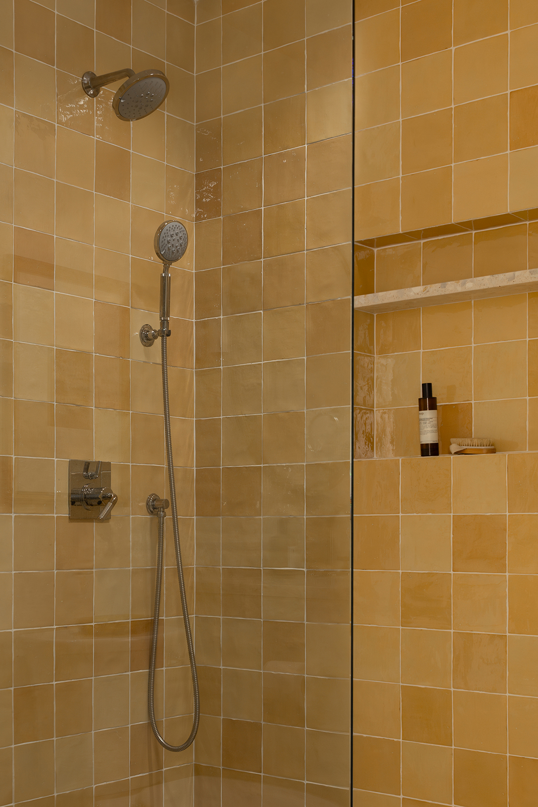 yellow tiled shower
