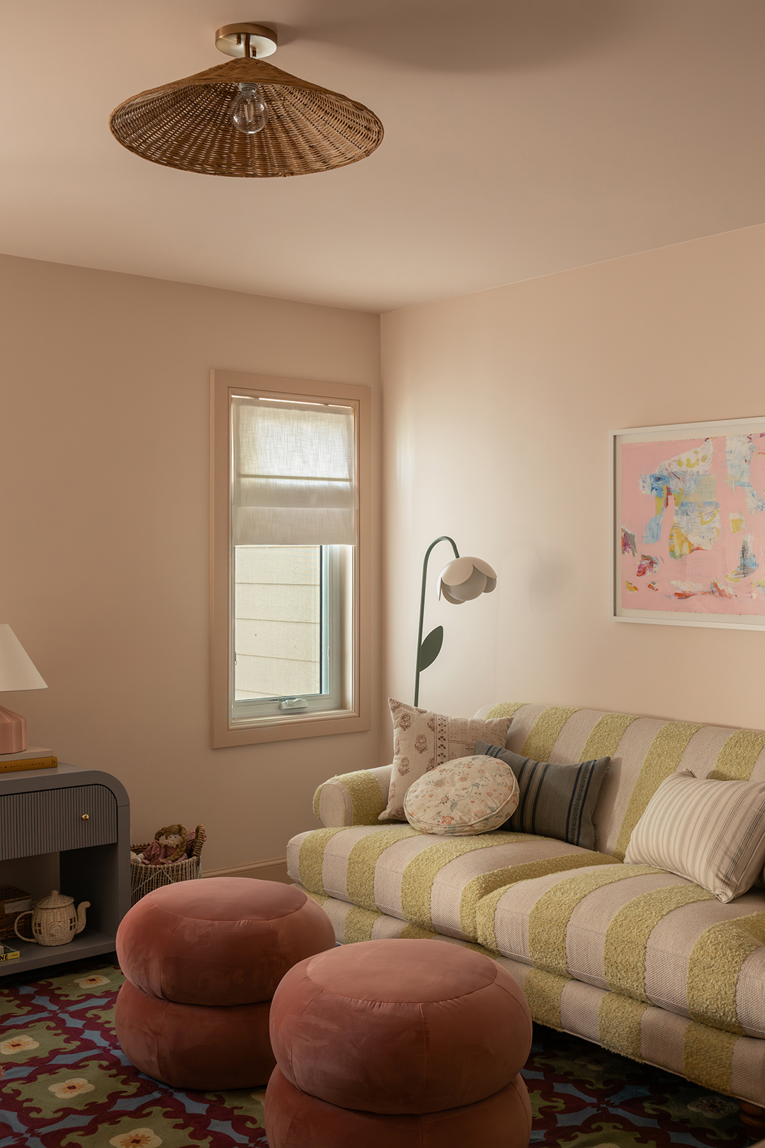 striped sofa in pink bedroom