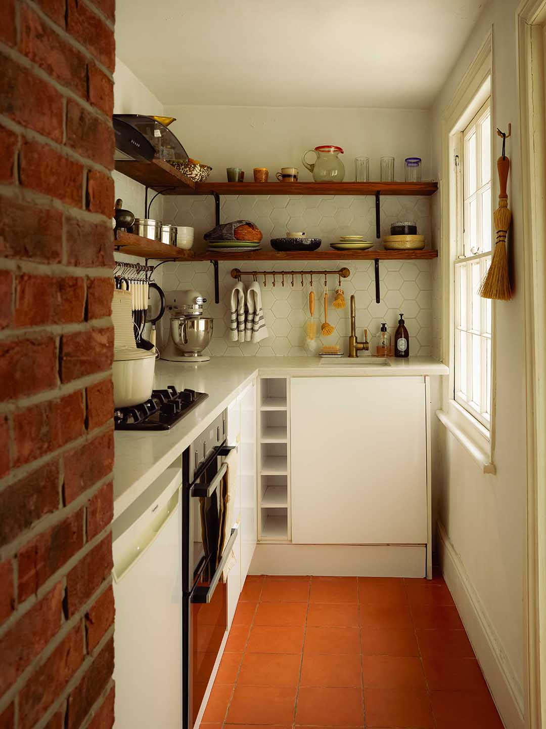 kitchen with brick wall and open shelves