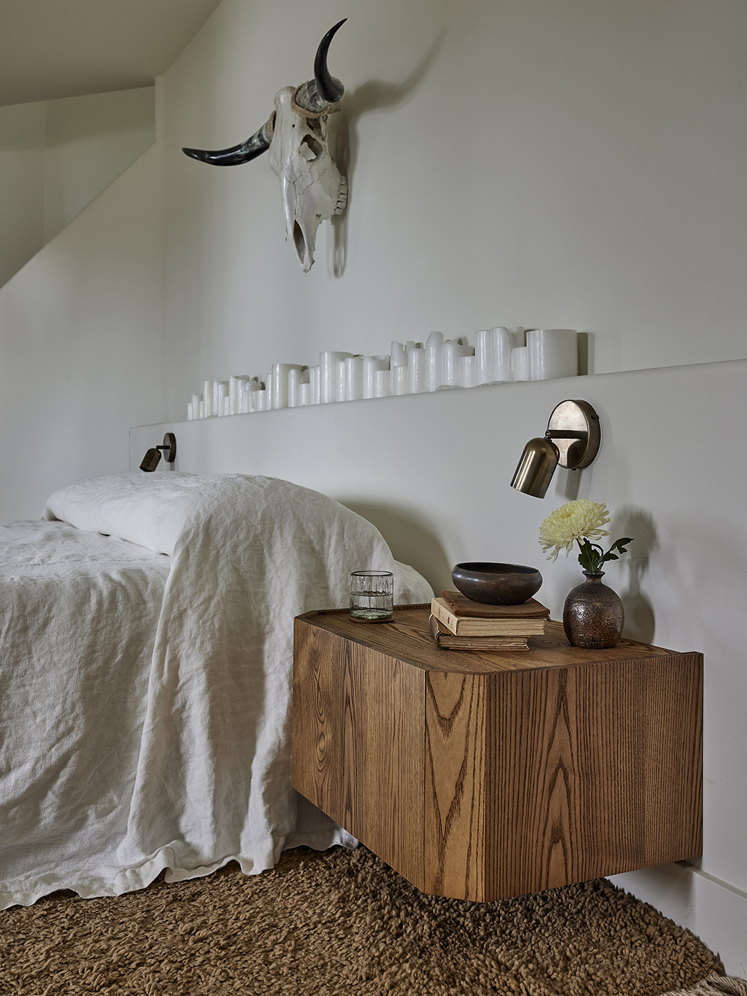 bedroom with candles above bed