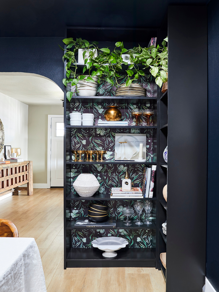 dark bookshelves with wallpapered background