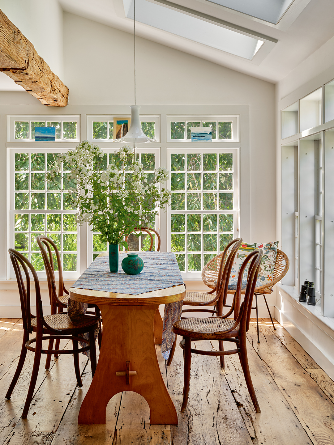 sunroom with table and bentwood chairs