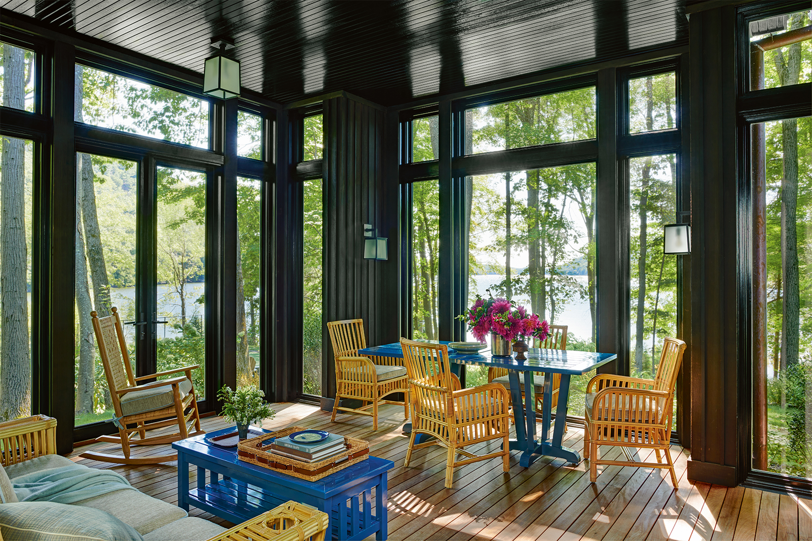 sunroom with views of a forest and a game table