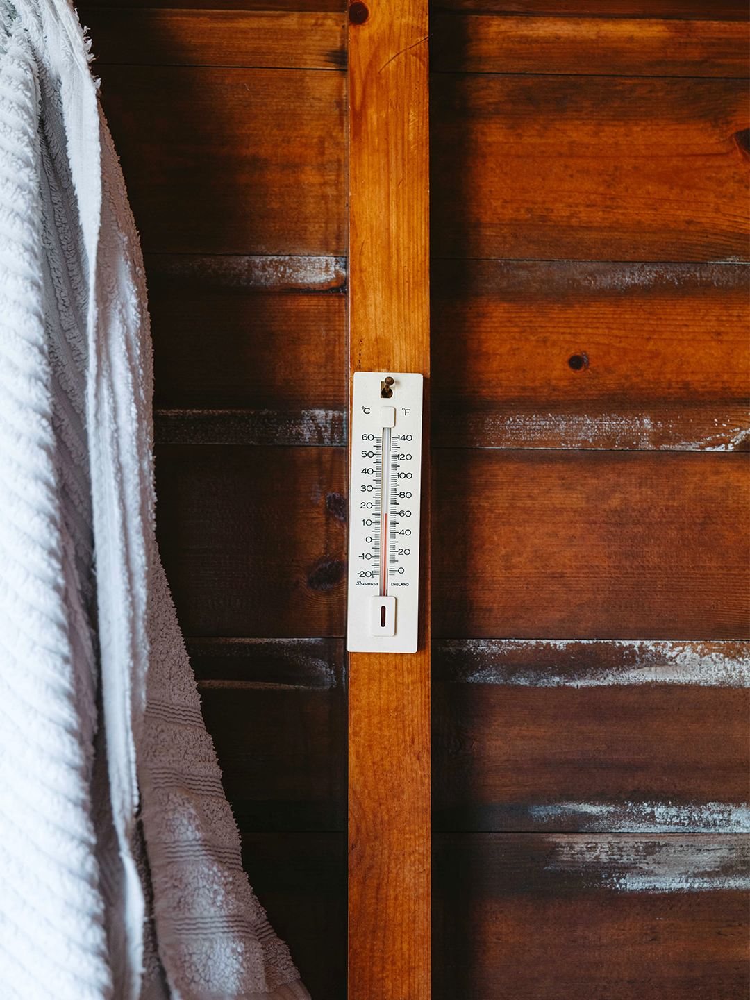 thermometer on wood wall