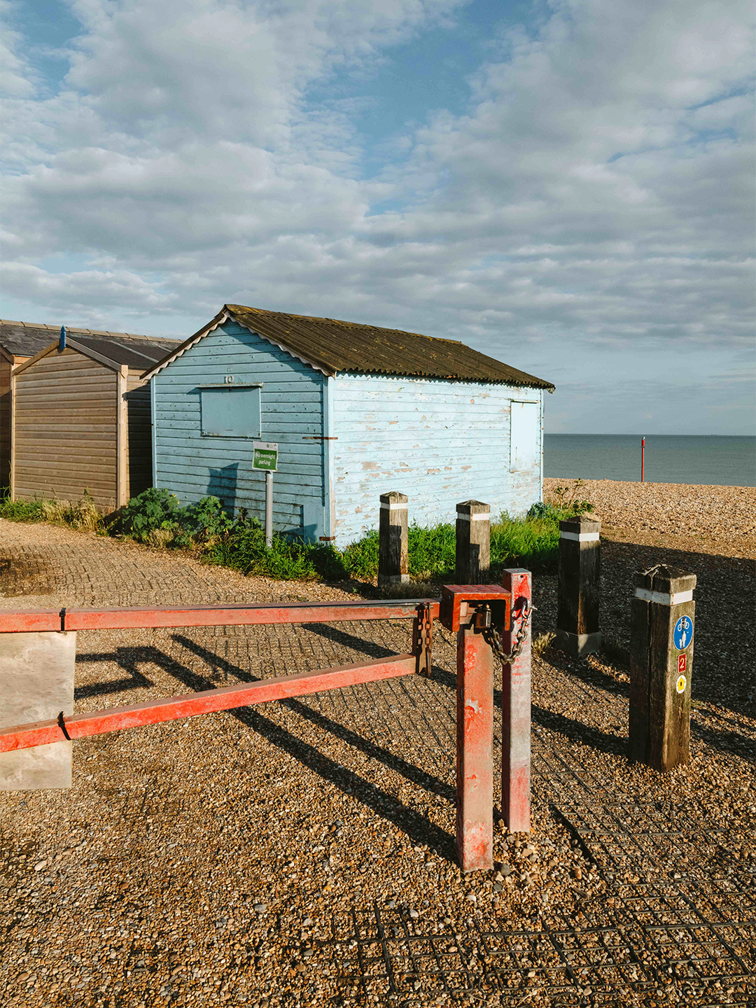 two beach huts near the ocean