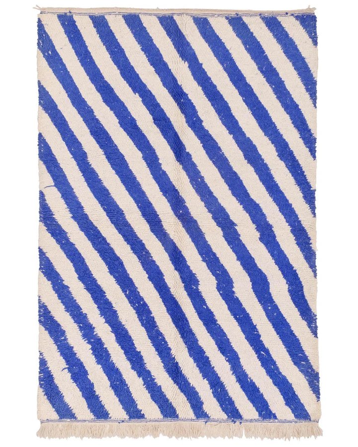 blue and white diagonal striped rug