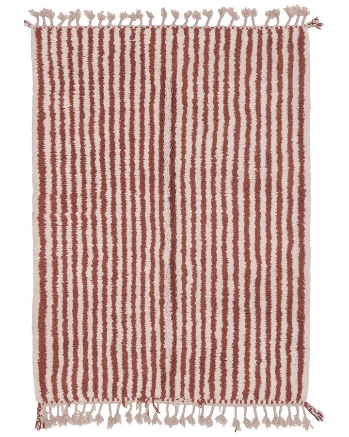 striped rug with braided tassel fringe