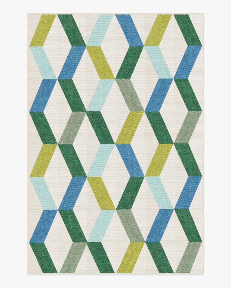 White rug with green and blue diamond-shaped pattern.