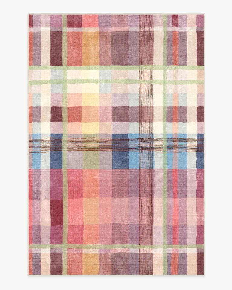 Pink plaid rug with cream, blue, and light yellow.