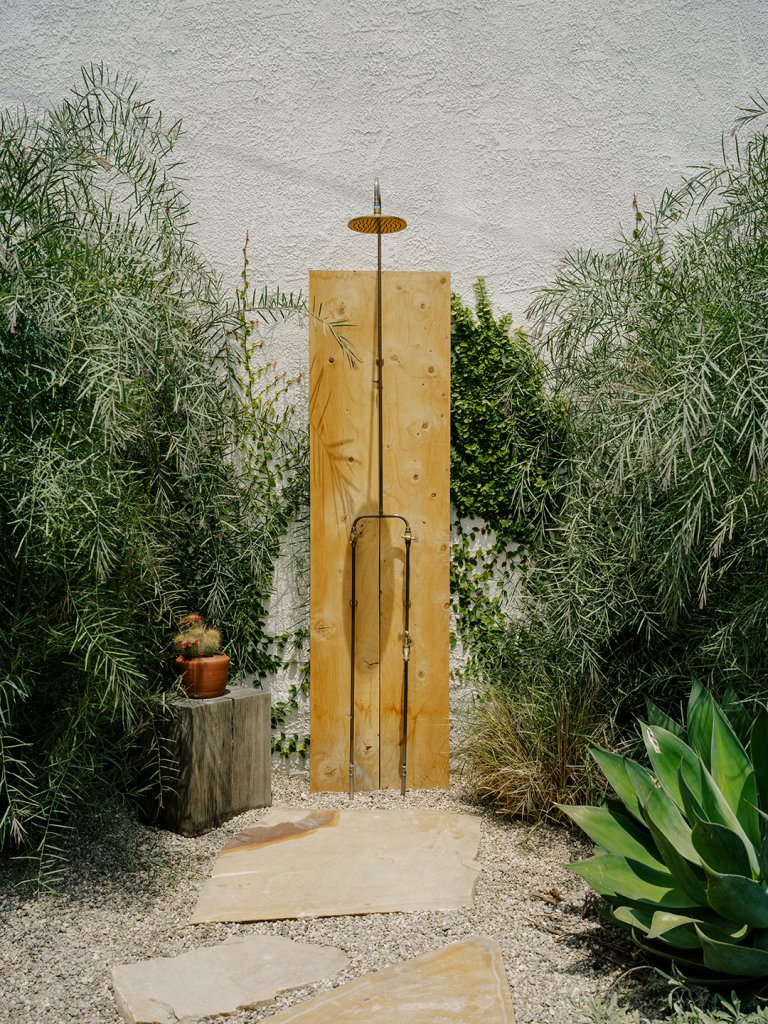 outdoor shower in a leafy nook