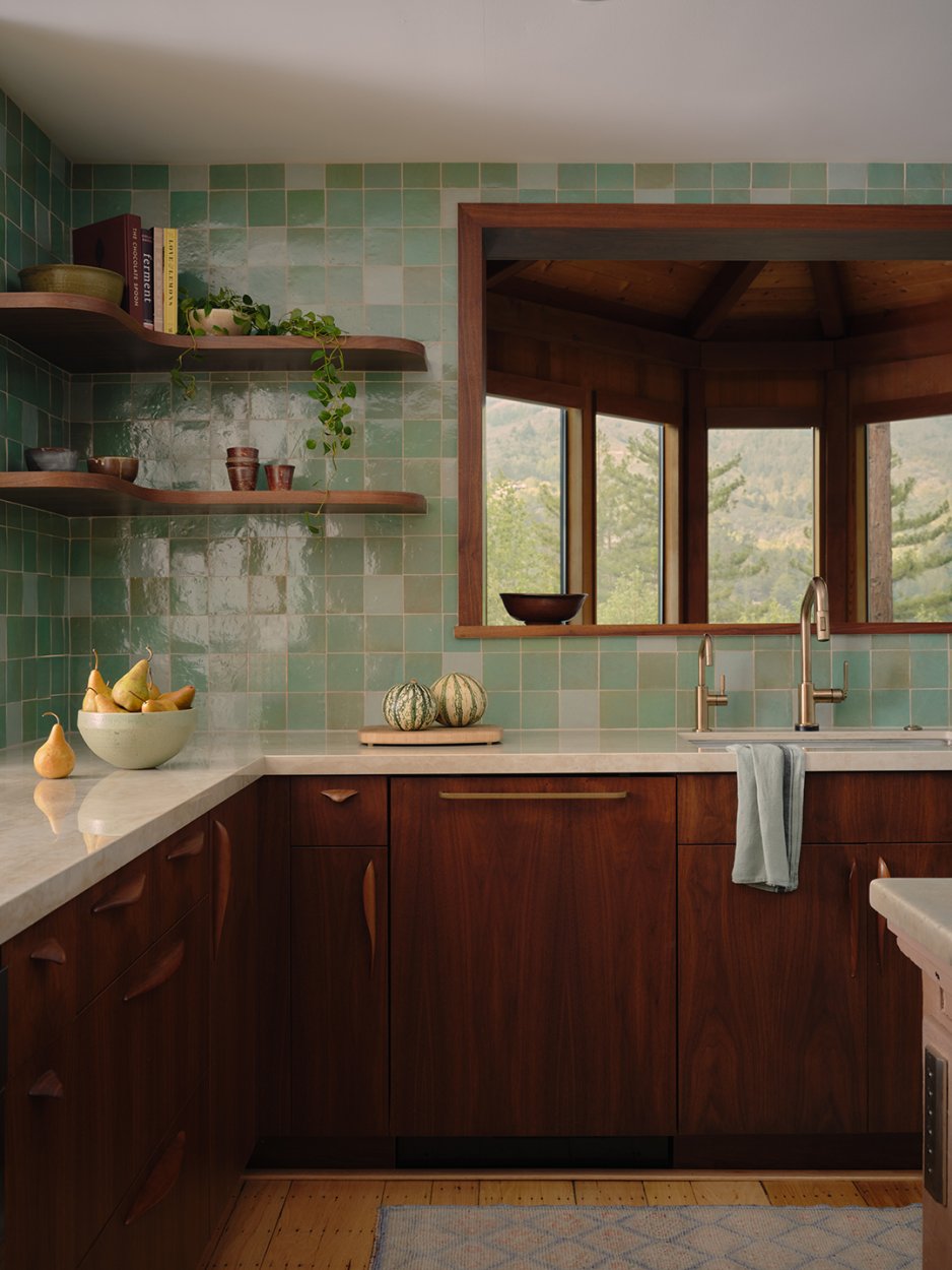 kitchen with wood cabinets and green tiles