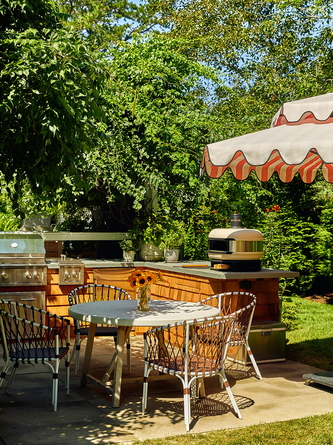outdoor area with dining table and umbrella
