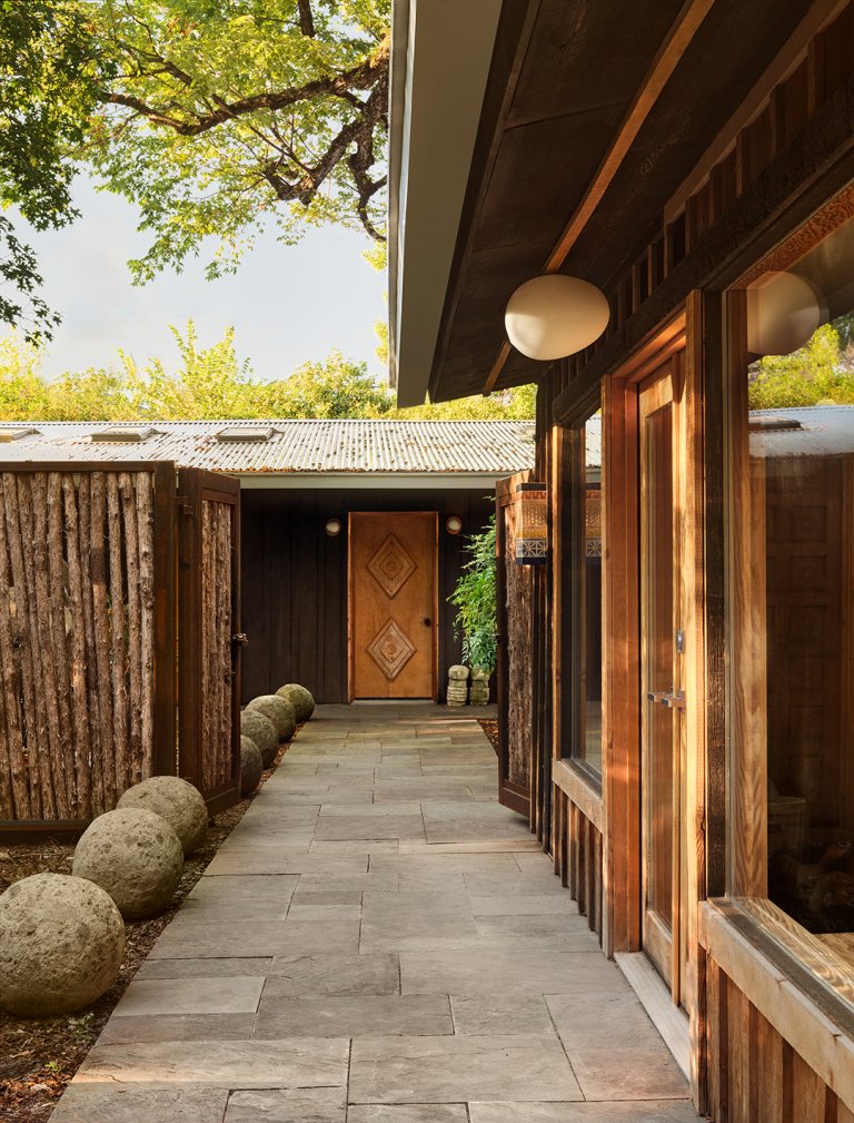 walkway to front door with reclaimed wood fence