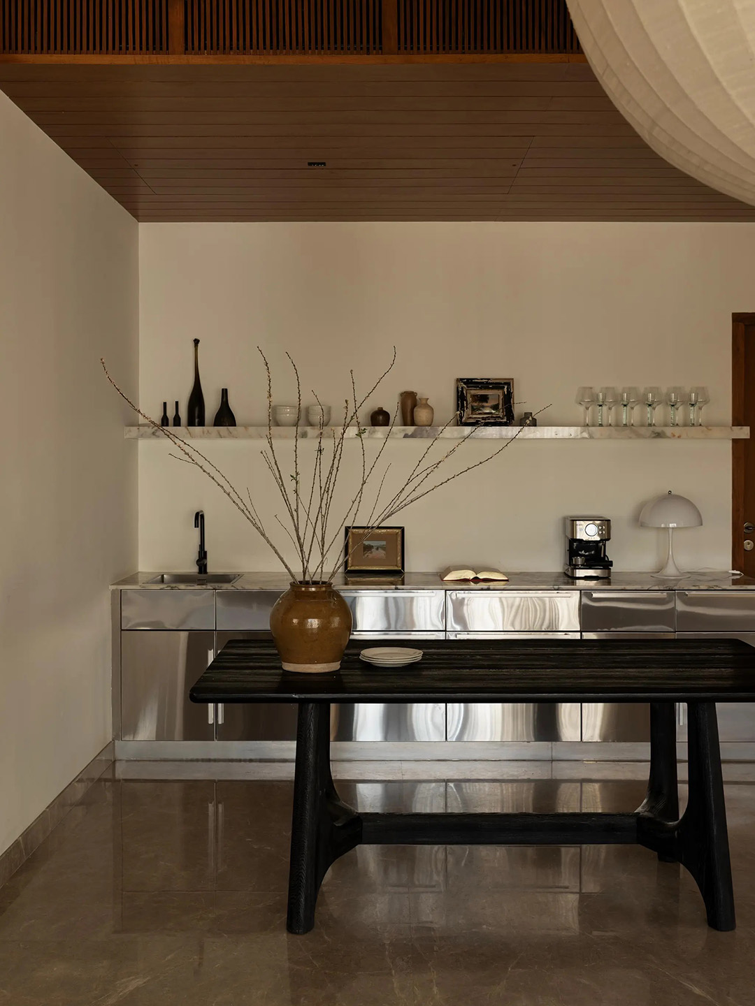 stainless steel kitchen with rustic wood island