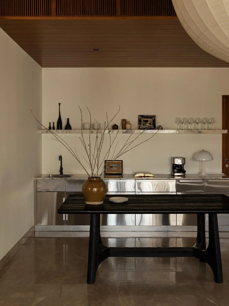 stainless steel kitchen with rustic wood island