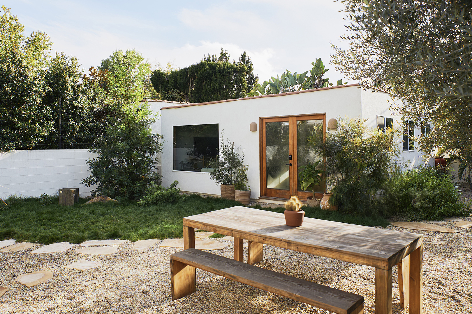 picnic table in front of a white building