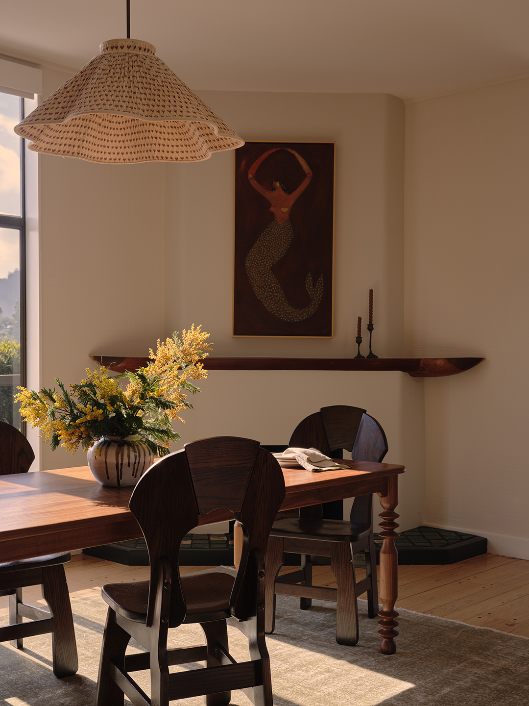 dining room with mermaid painting