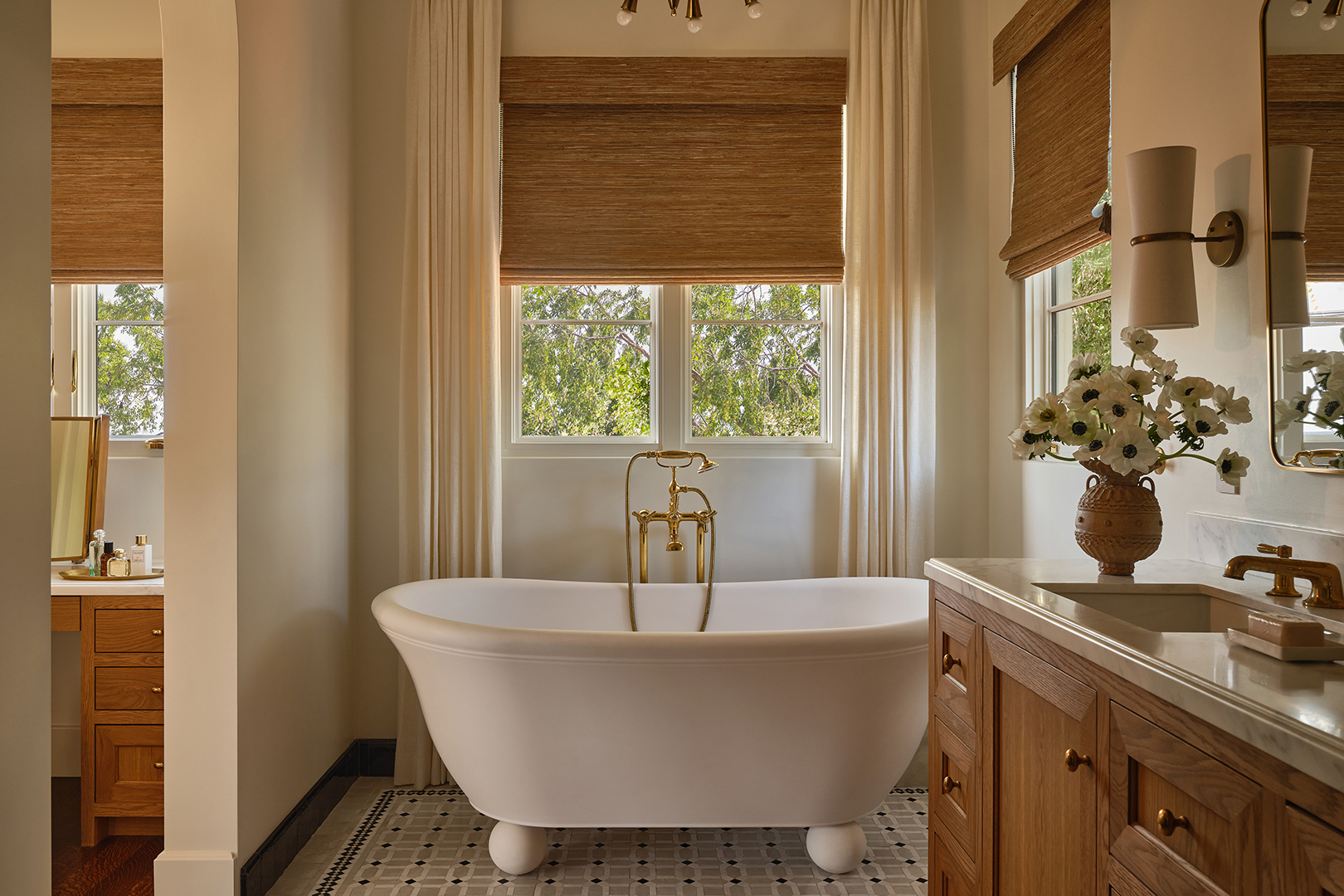bathroom with large white tub