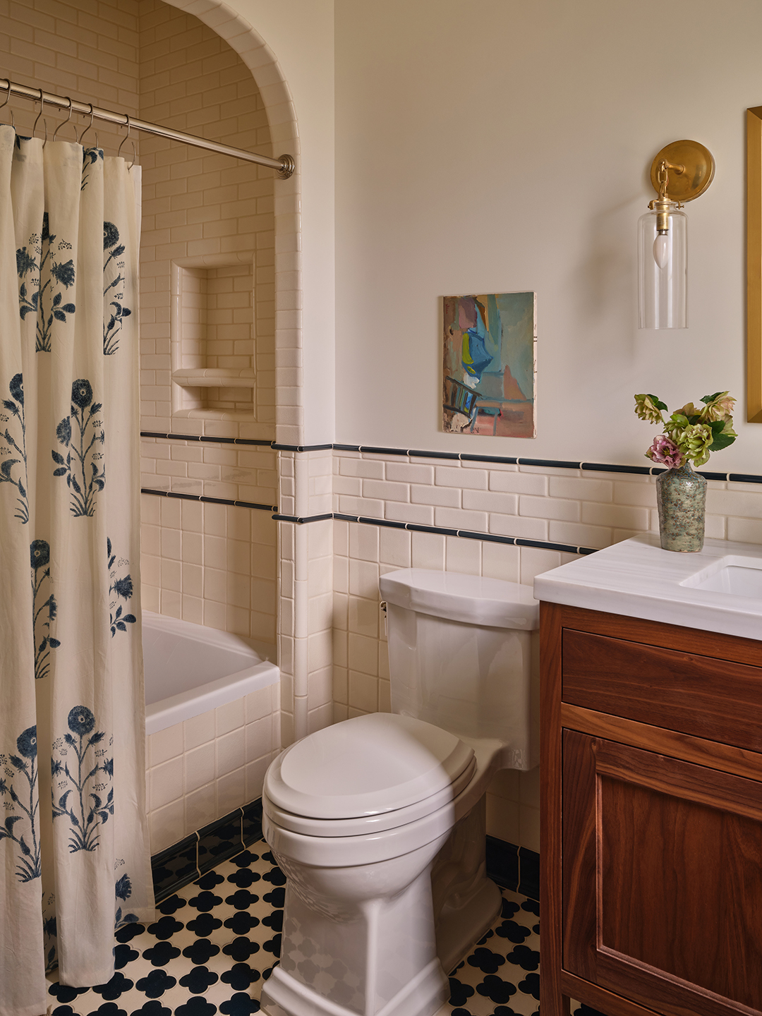 guest bathroom with blue and white tile
