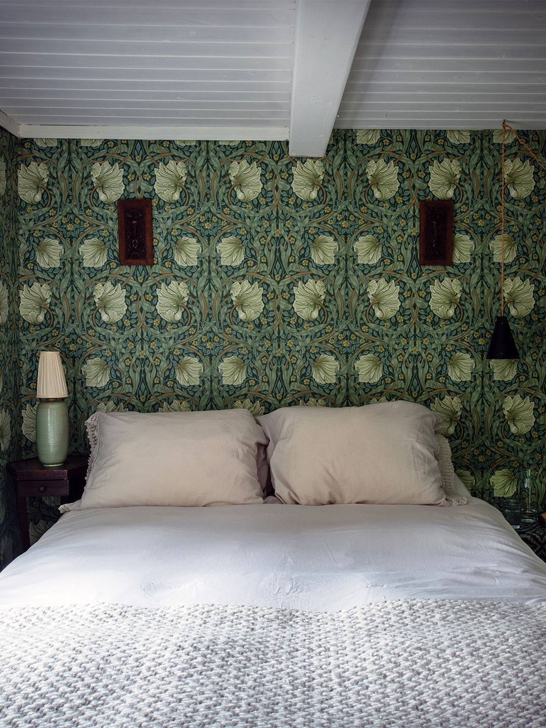 bedroom with wallpapered walls