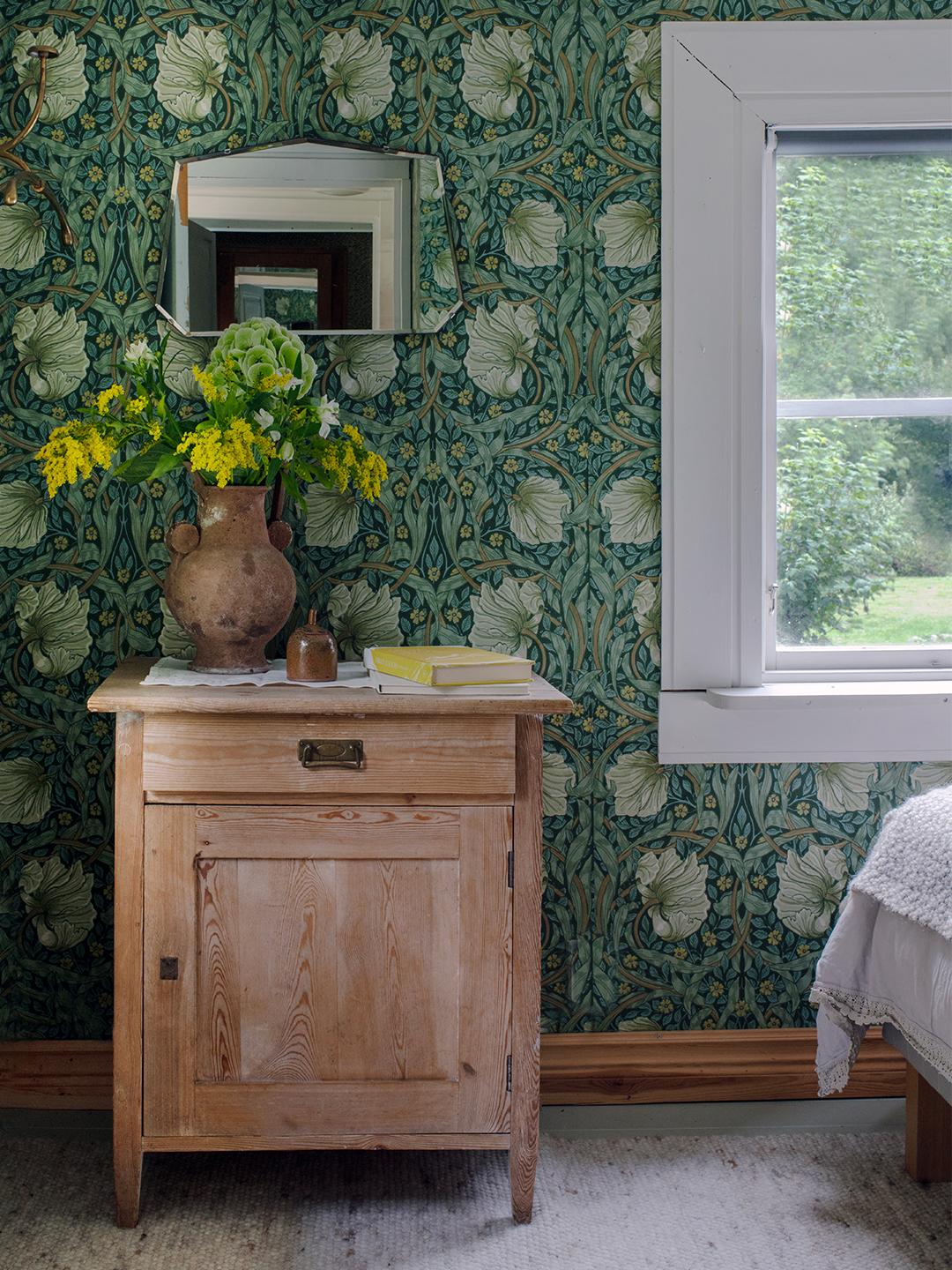 bedroom with wallpapered walls
