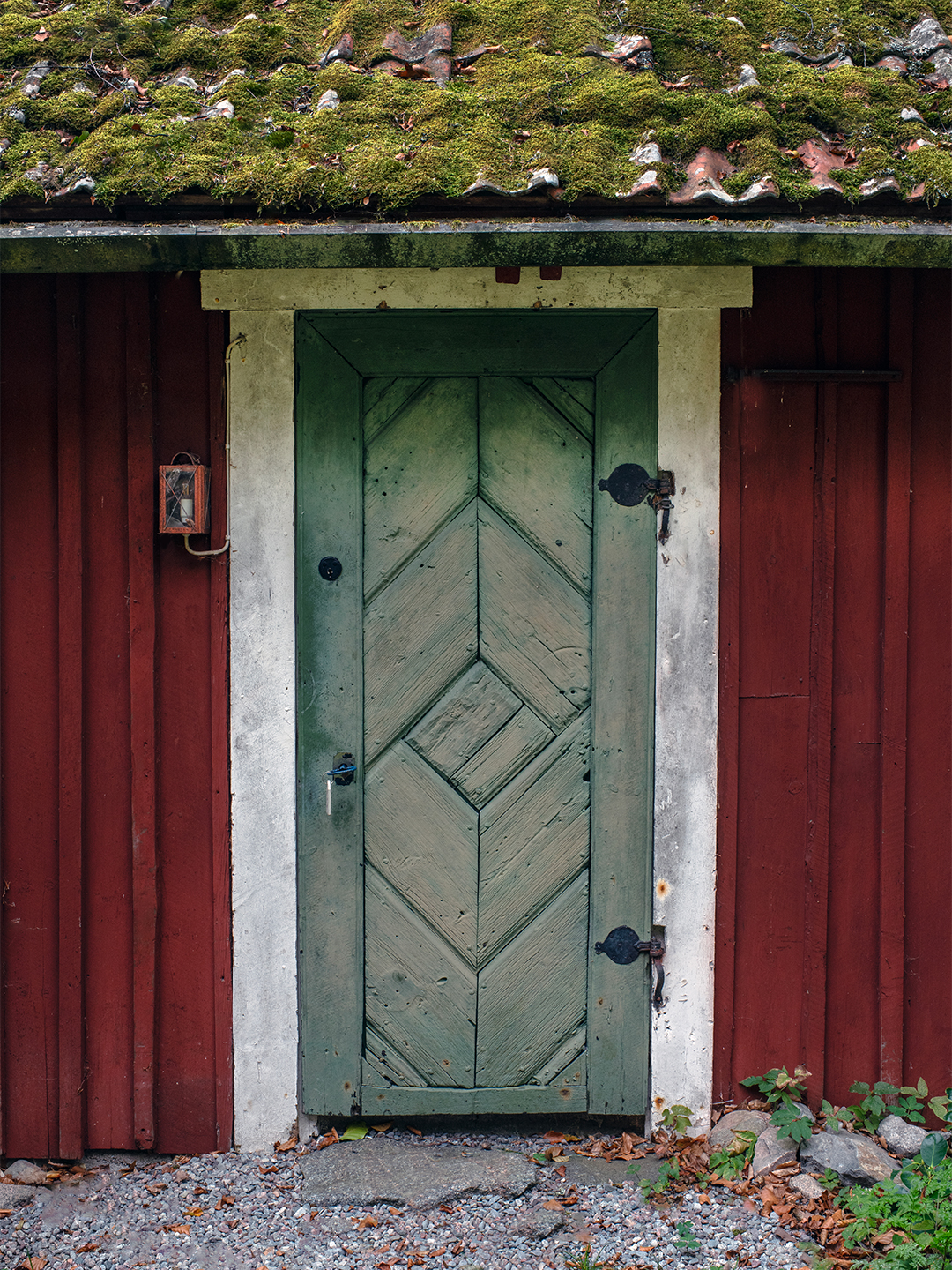 red cottage with old door