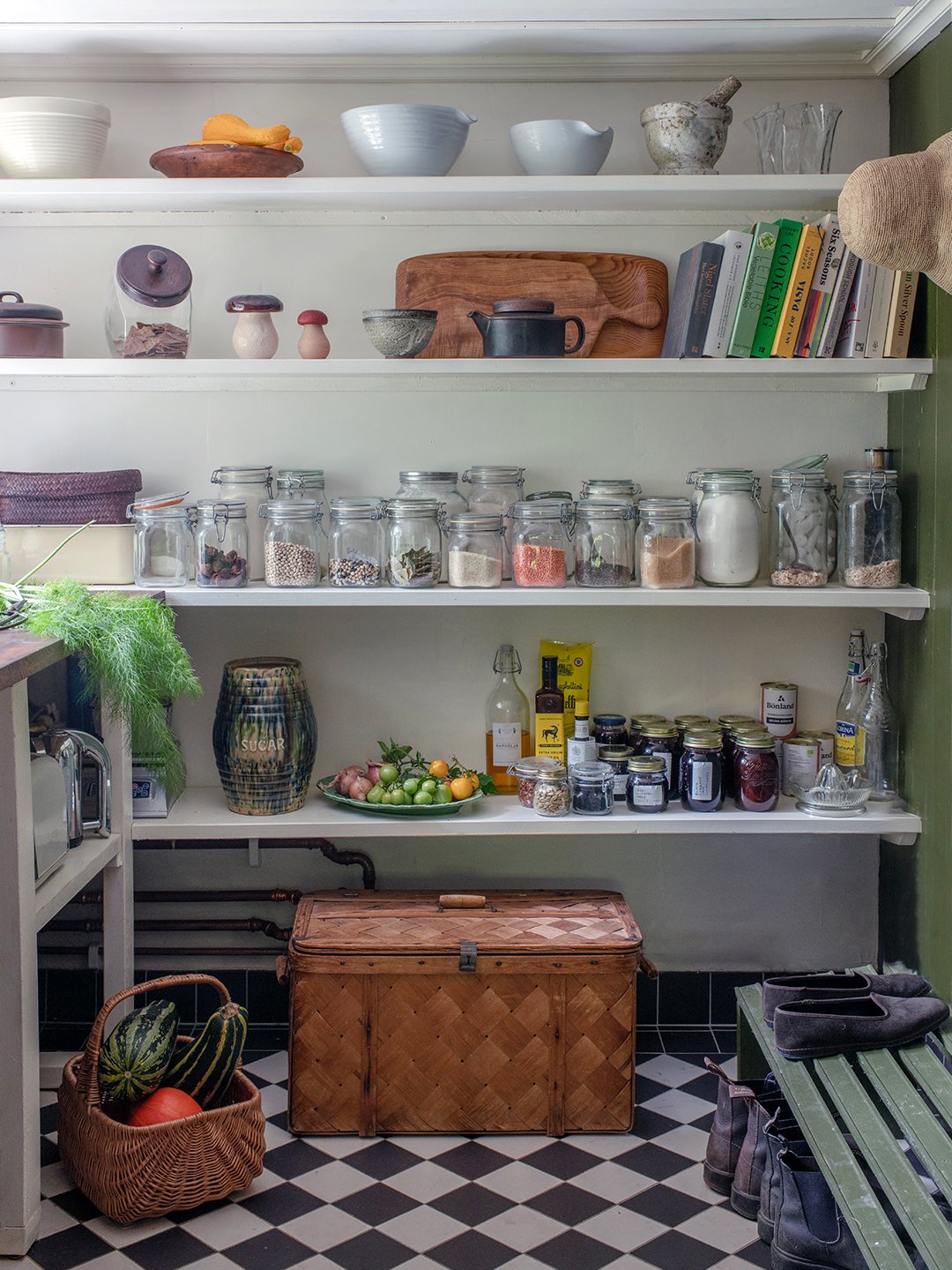 pantry with open shelving and checkered floor