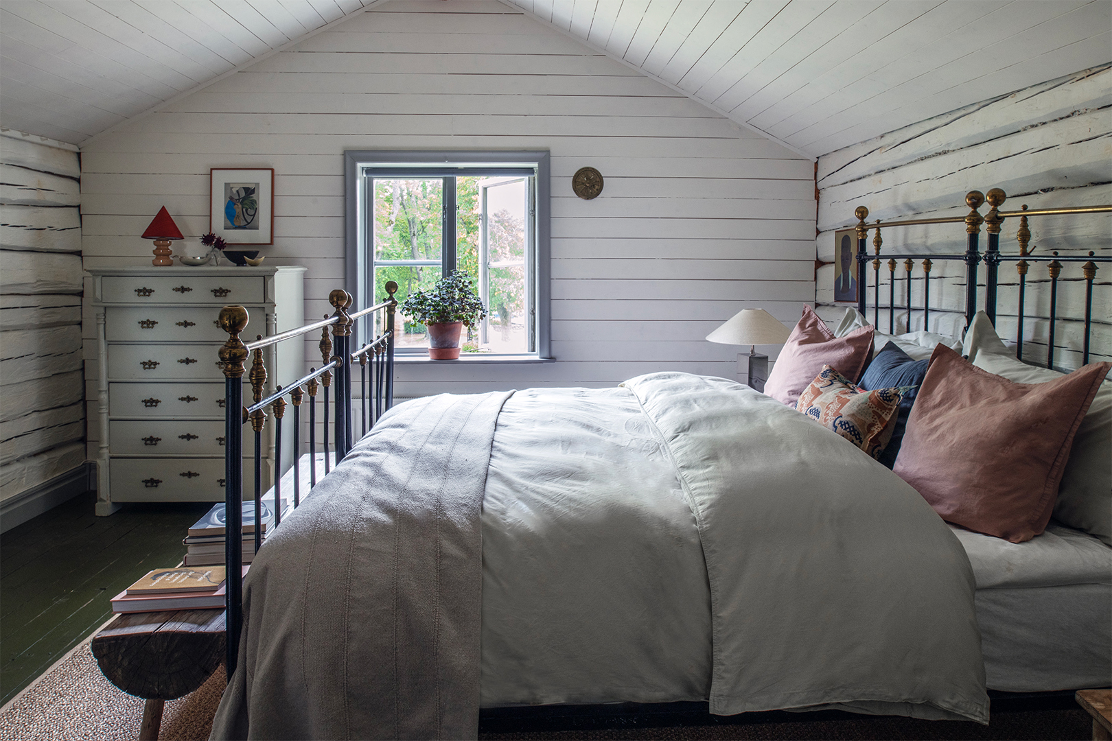 white bedroom with metal frame bed