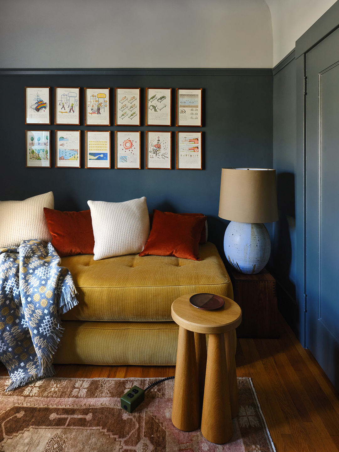 blue living room with gallery wall