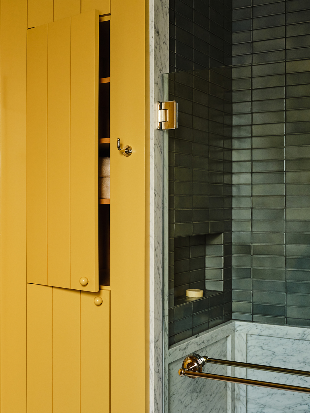 jib door in yellow bathroom