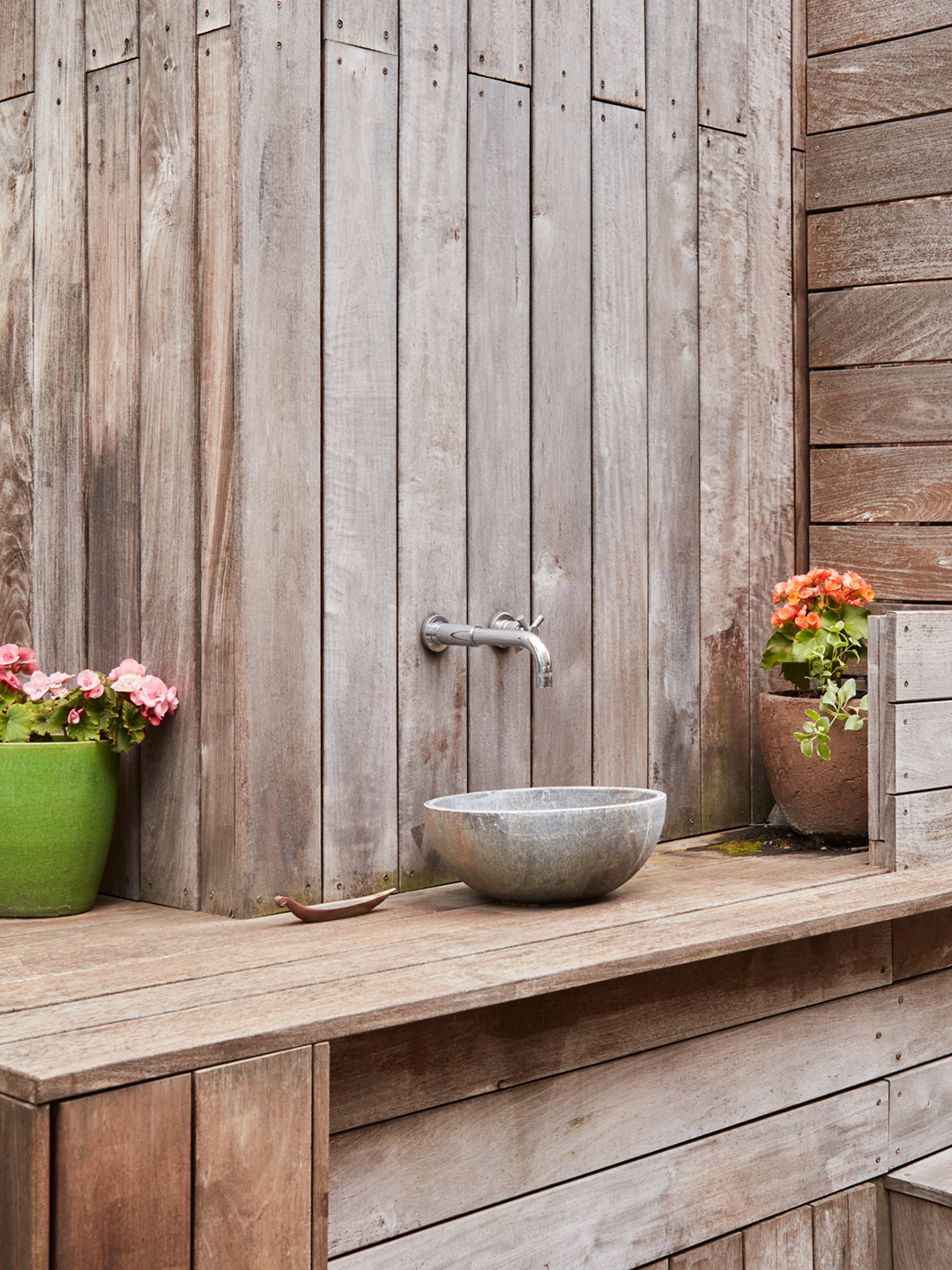 wooden deck area with sink