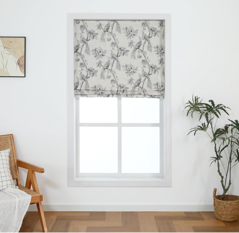gray and white peacock-patterned roman shades