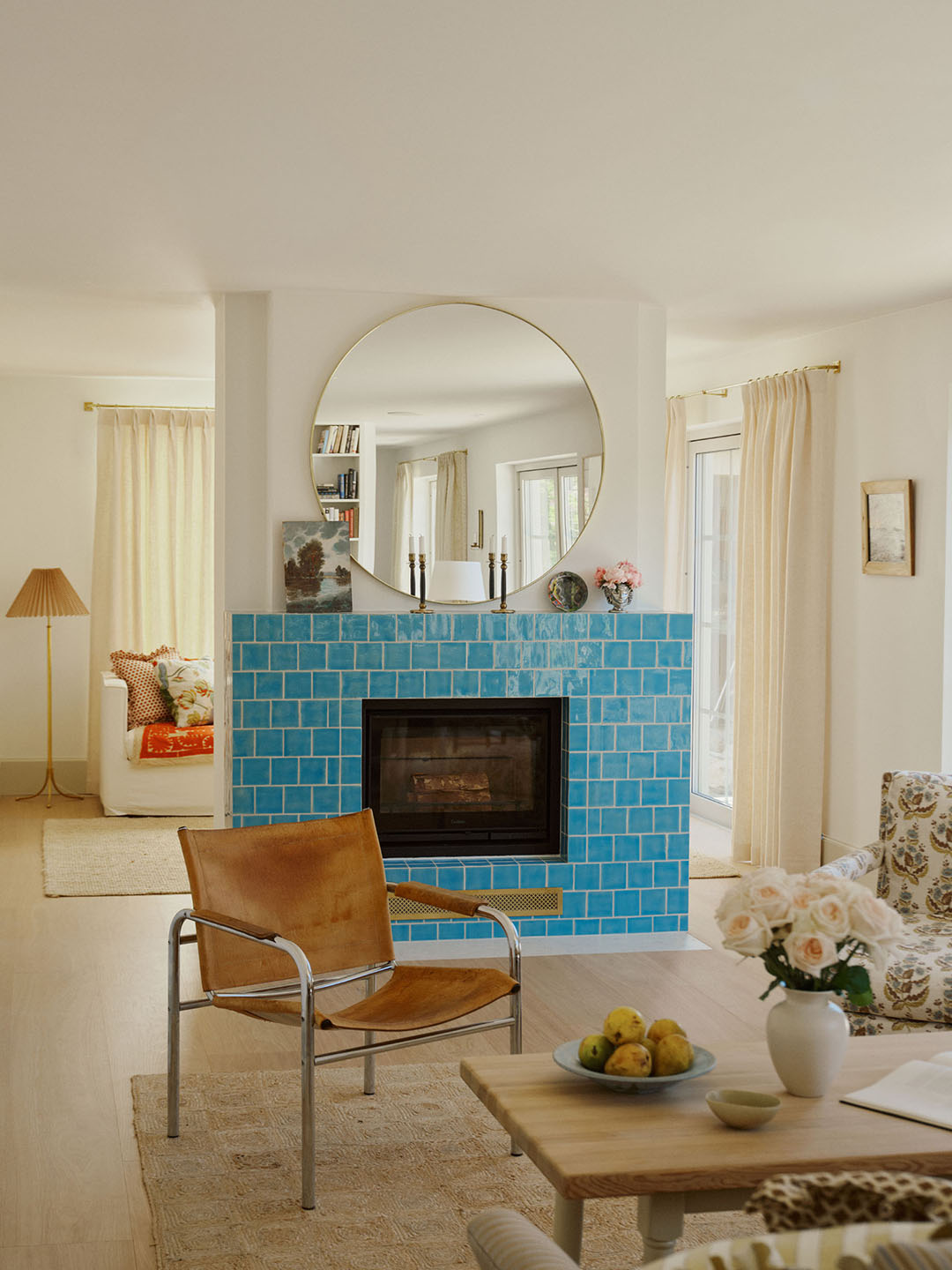 This Swedish Seaside Home Skips Shells in Favor of Sandy Hues and a Bright Blue Fireplace