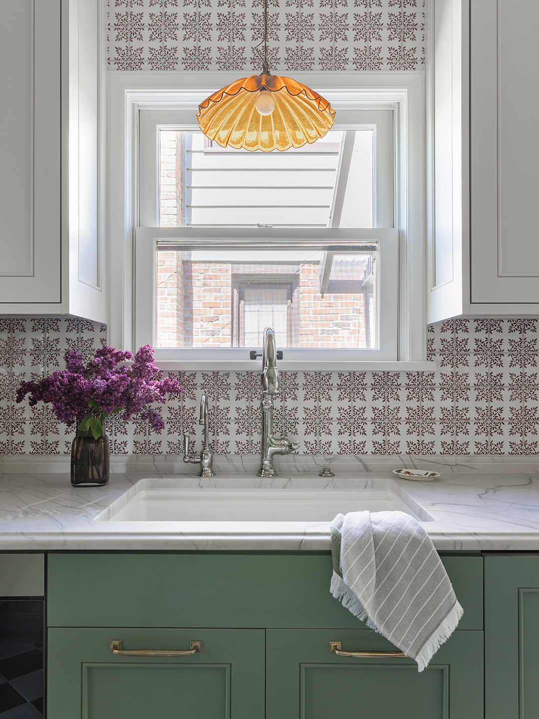green galley kitchen sink in front of window