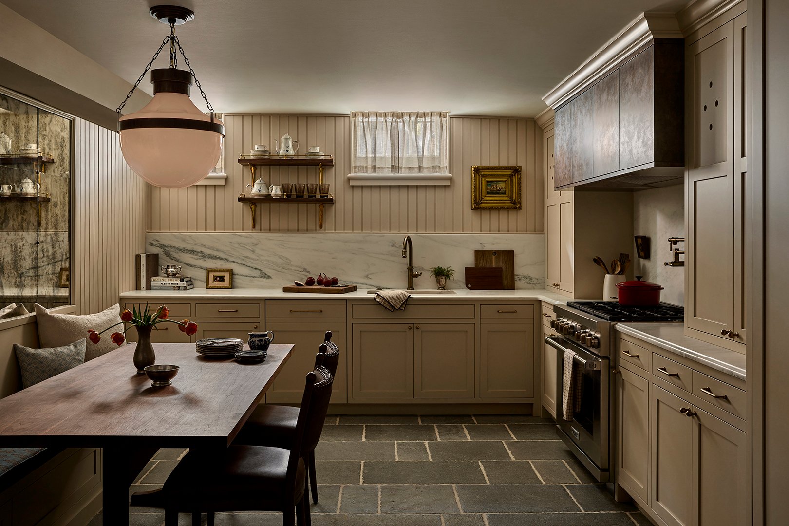 kitchen with cream accents and stone tile floor