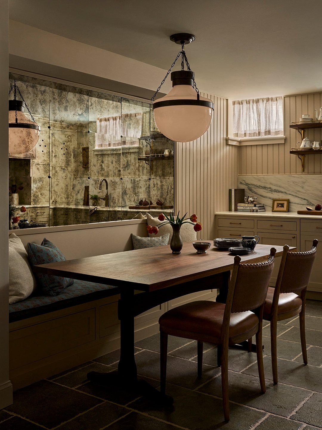 dining room table in kitchen with hanging pendant