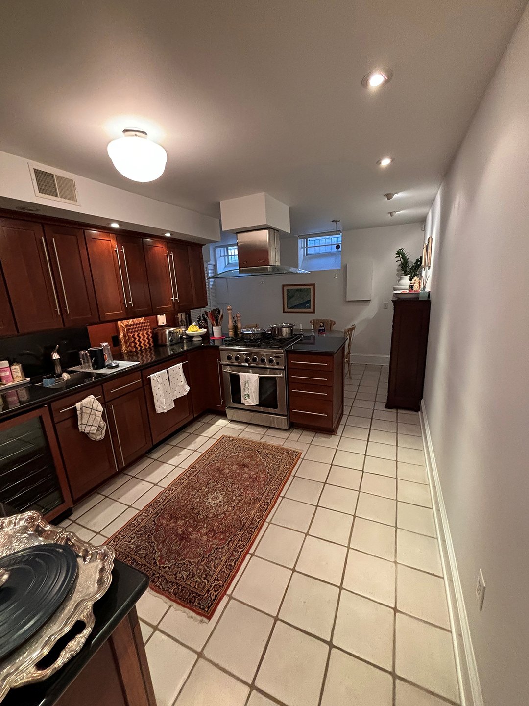 white kitchen with wood cabinets pre-renovation