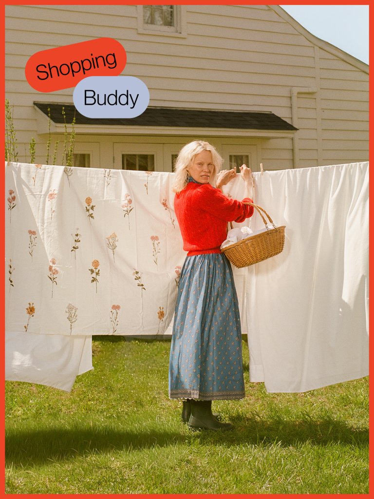 woman hanging sheets