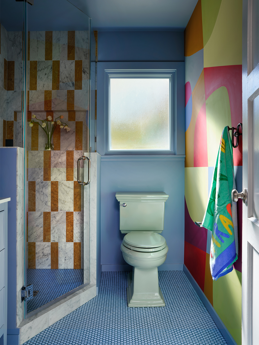 bold blue bathroom with mural