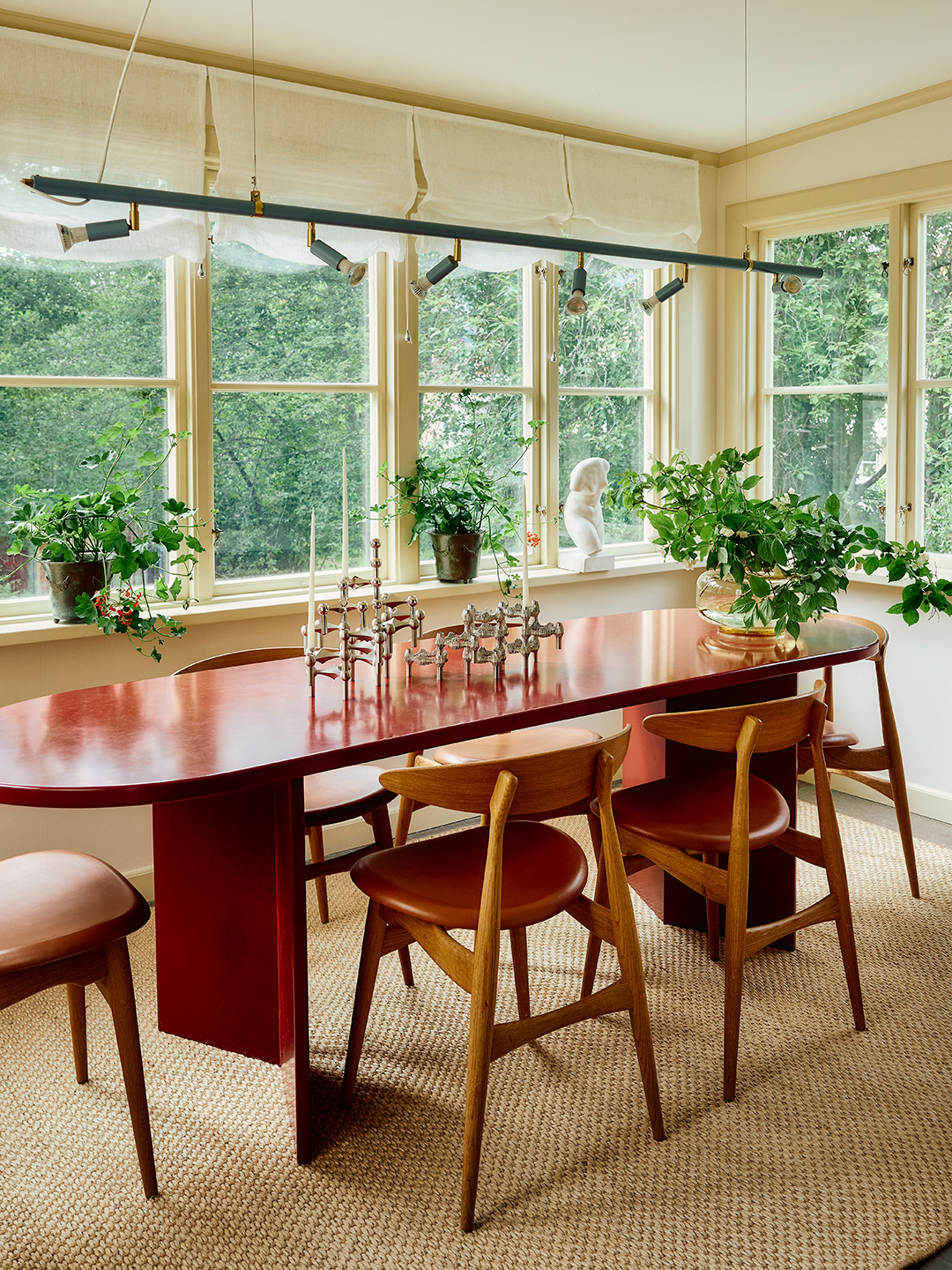 dining room with long rounded table