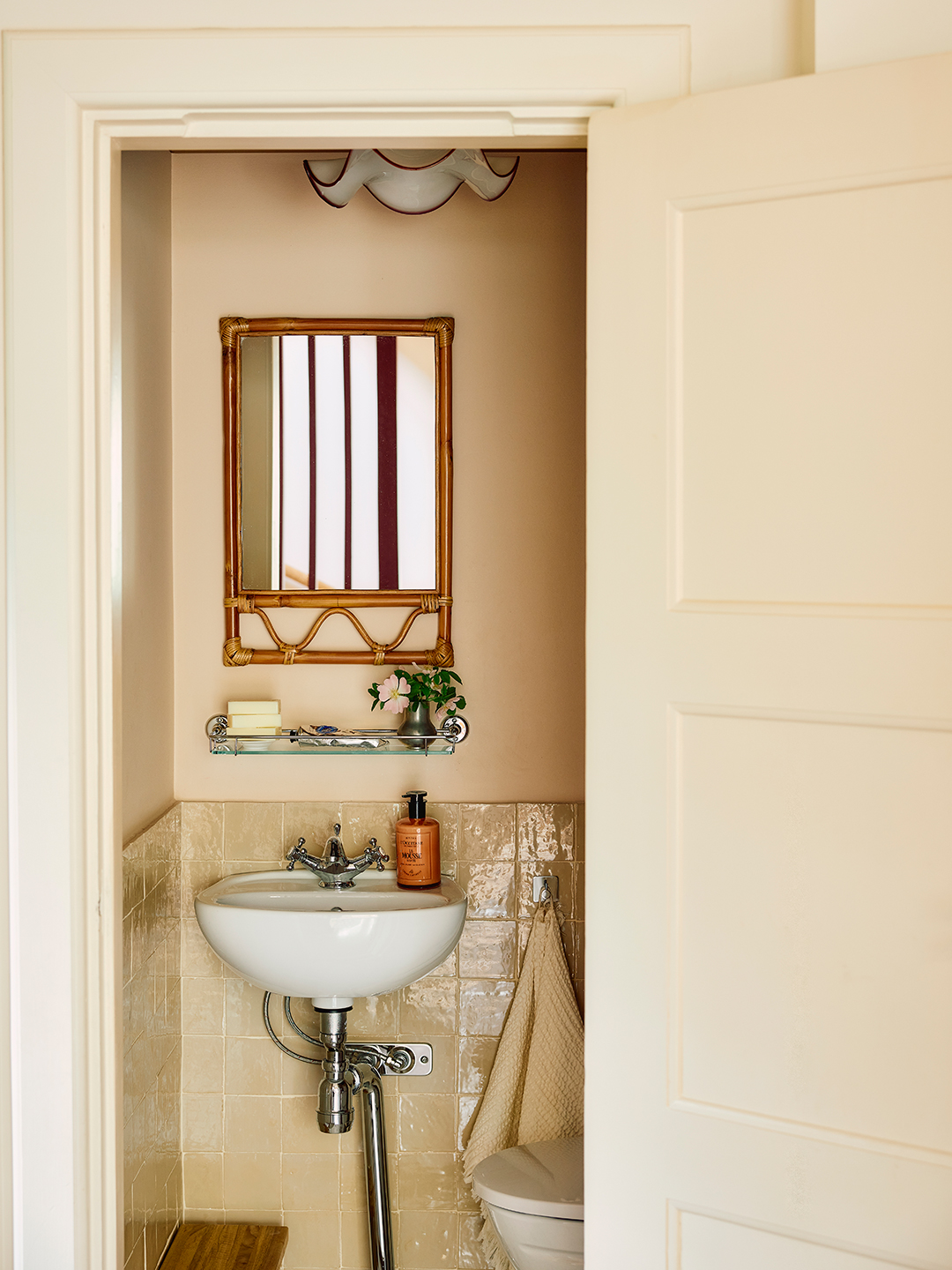 powder room with bamboo mirror